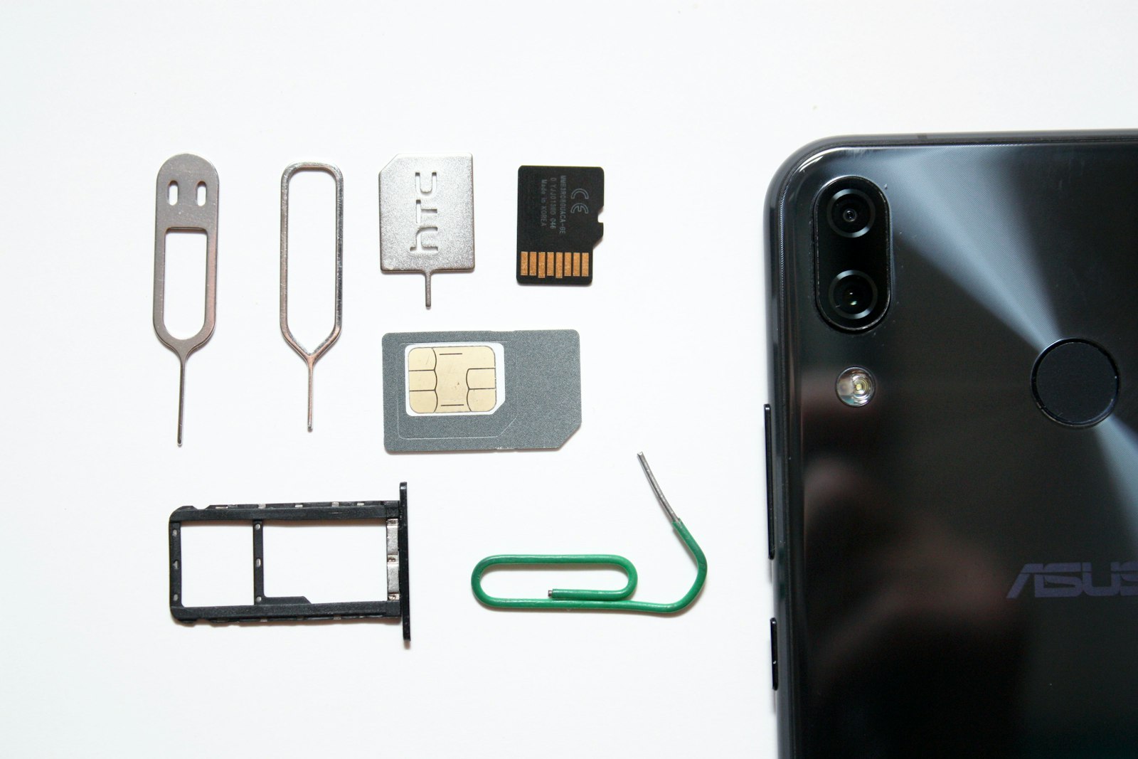 A SIM card being removed from a smartphone, illustrating the physical card eSIM is replacing