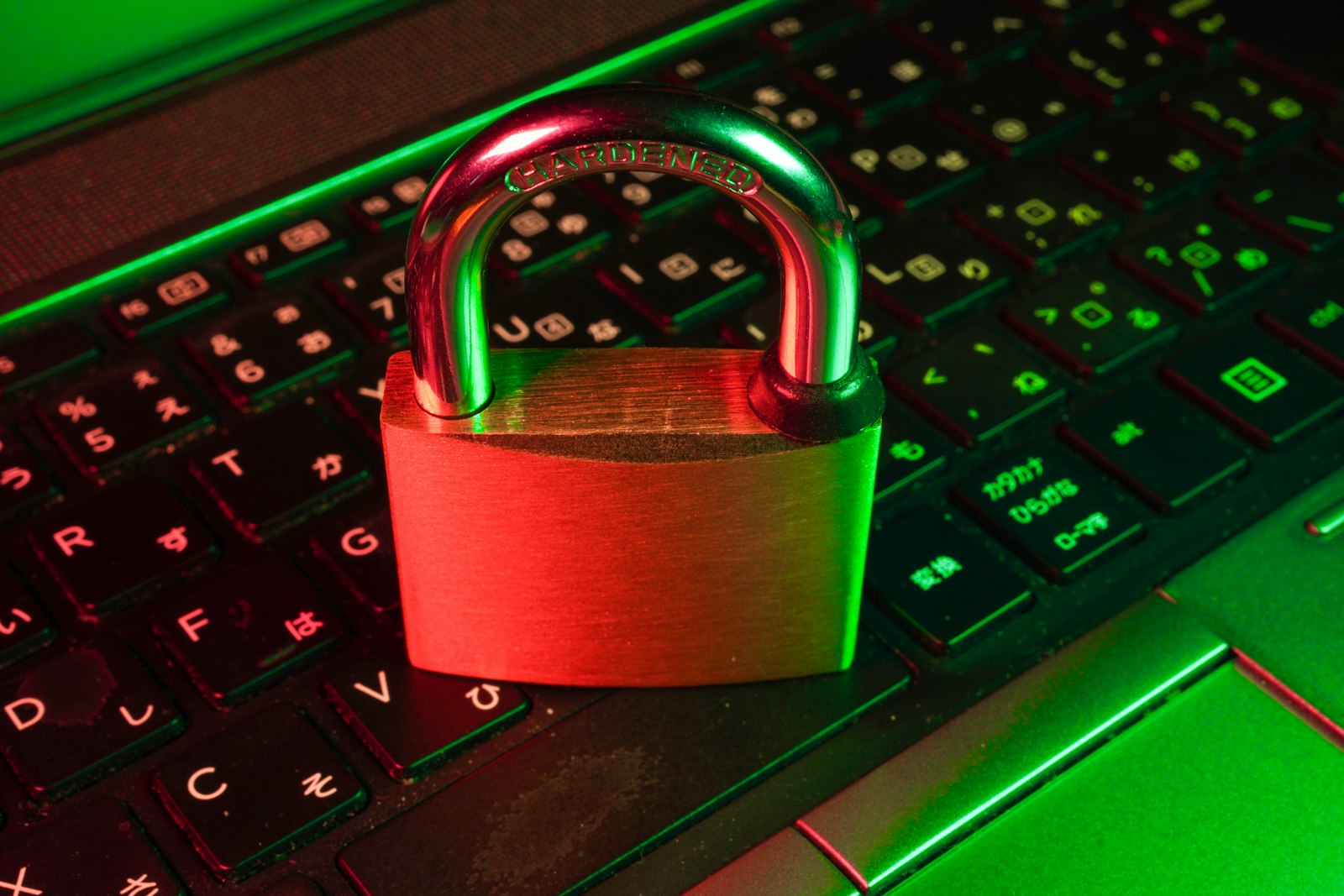 Red padlock on a computer keyboard representing account security and phishing scam protection