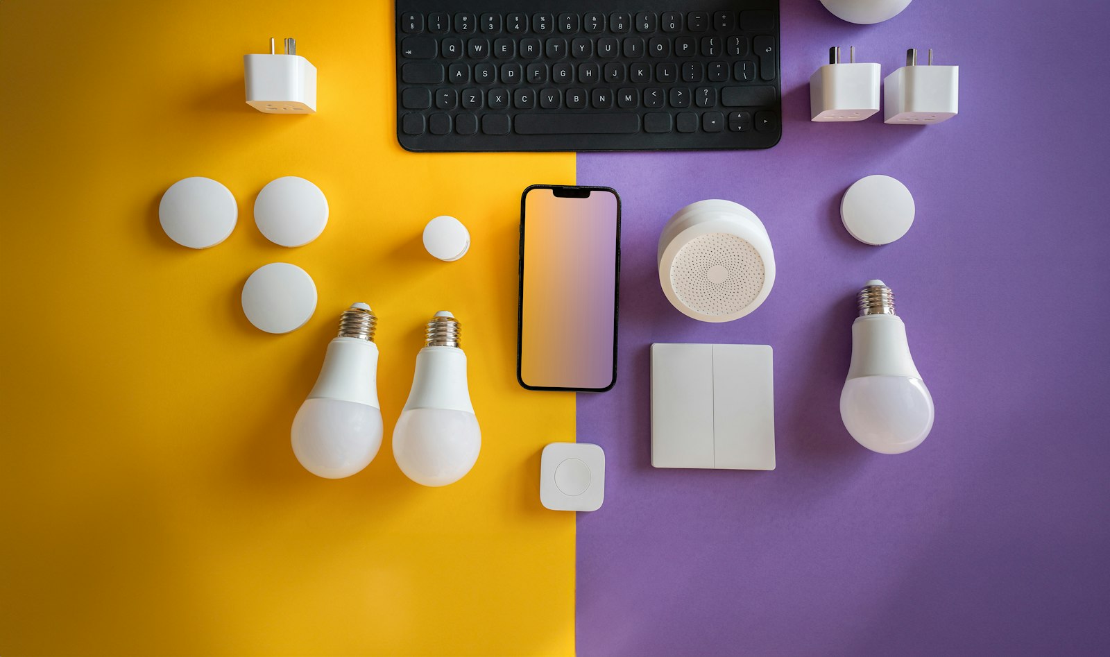 Light bulbs and electronics on a colorful background illustrating the Matter smart home standard